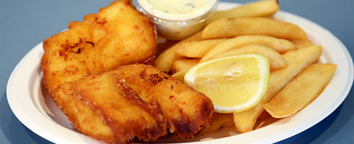 Fish and chips, with fresh halibut usually brought from Alaska, a favorite seafood dish by our clients!